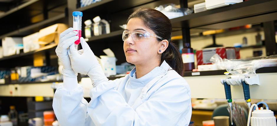 Lab technician with test tube